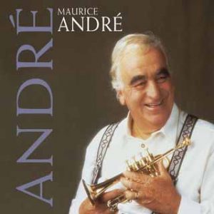 Maurice André holding a Selmer 4 Valve Piccolo Trumpet